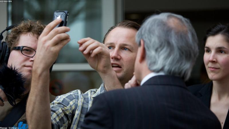 smartphone showing a cryptocurrency portfolio graph going up