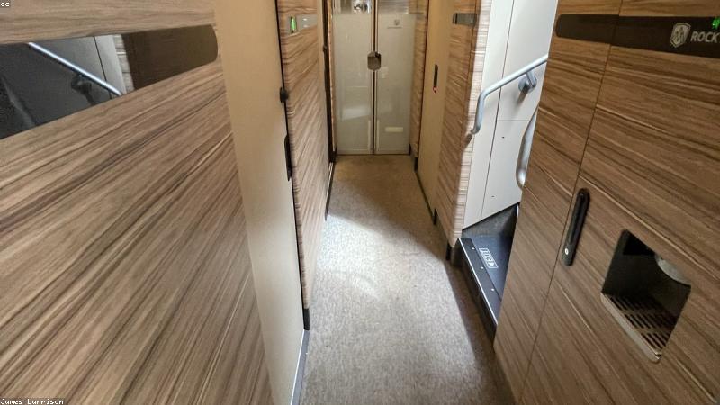 A sleek, modern digital illustration showing a smartphone displaying a crypto portfolio with a subtle Union Jack flag in the background to signify the UK market.