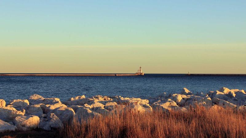A professional summary graphic showing a gold Bitcoin next to a Union Jack flag, a glowing green checkmark, and a smartphone displaying a trading chart.