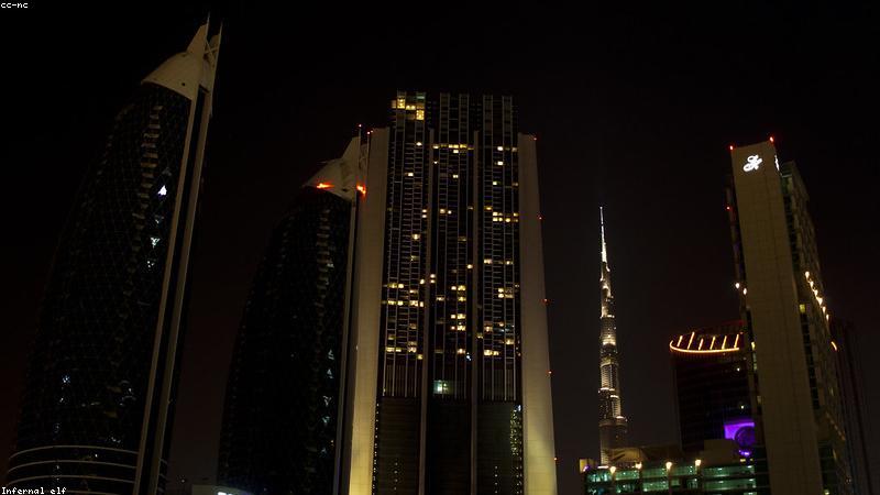 ultra thin modern laptop on a wooden desk with a cup of coffee and notebook