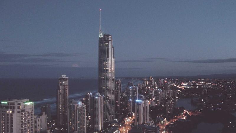 Two financial analysts in a modern high-tech office looking at holographic projections of cryptocurrency data and global adoption maps