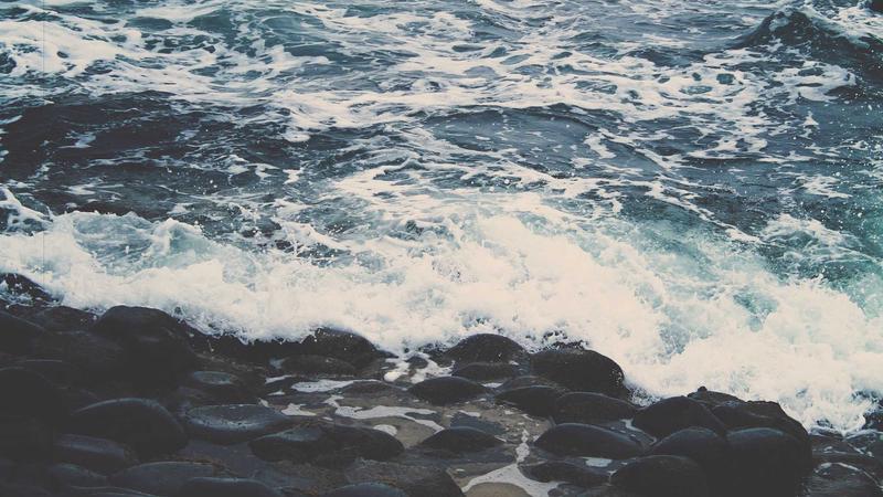 A split-screen illustration showing a stressed worker typing long prompts into a standard chat interface on the left, and a relaxed worker simply clicking a button on a custom ChatGPT agent interface on the right.