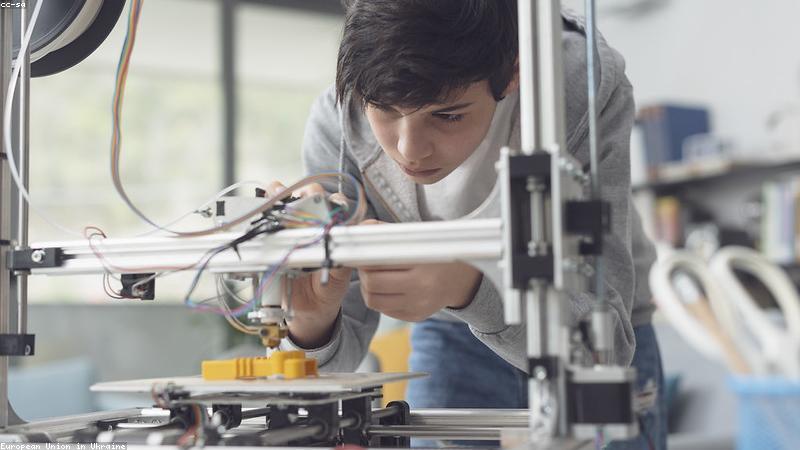 smart home desk setup with iphone charging stand and laptop