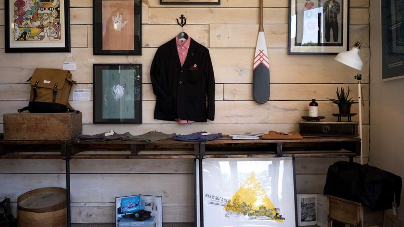 A sleek graphic showing a smartphone screen displaying a smartwatch comparison tool interface, surrounded by various smartwatches like Apple Watch, Samsung Galaxy Watch, and Garmin.